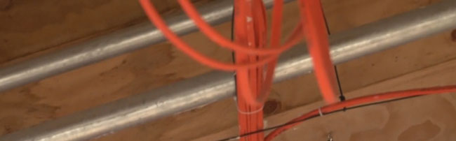 Bright orange wires in a new building