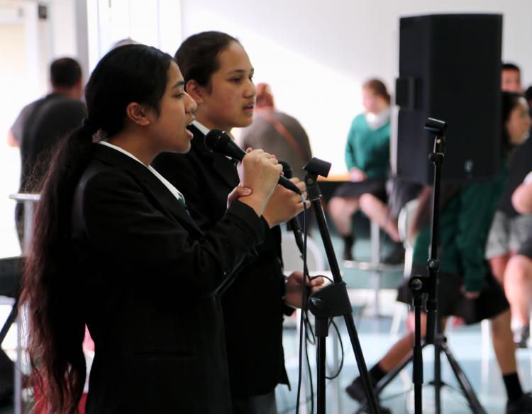Taita college music students perform pieces in front of parents and guests