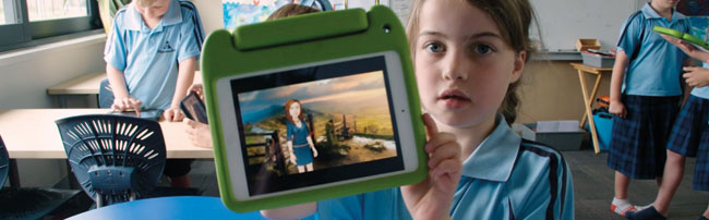 Student displaying a languge learning app on an ipad