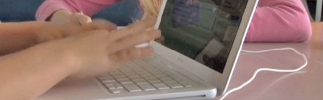 A student blogging on a laptop
