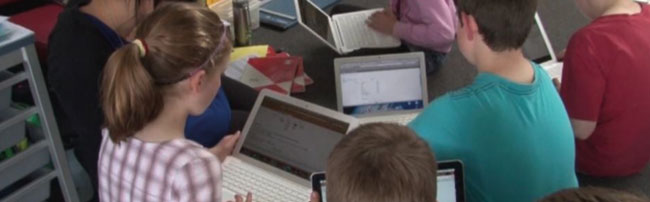 Children accessing their e-portfolios on a computer