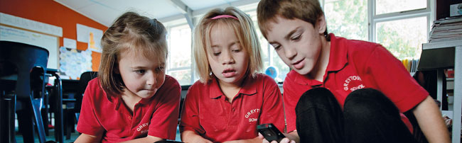 Students working together with a smartphone